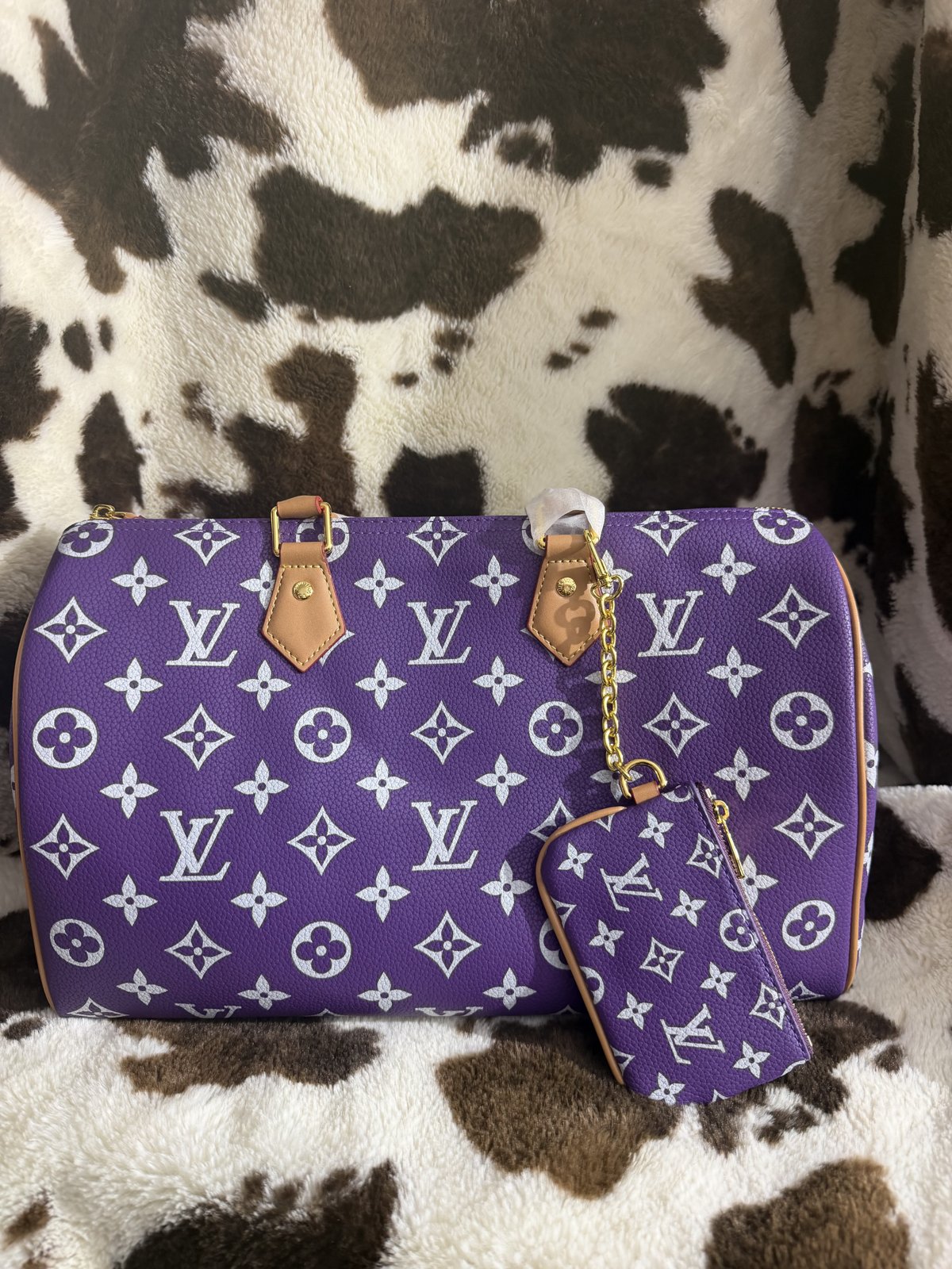 Purple monogram duffle bag with matching pouch